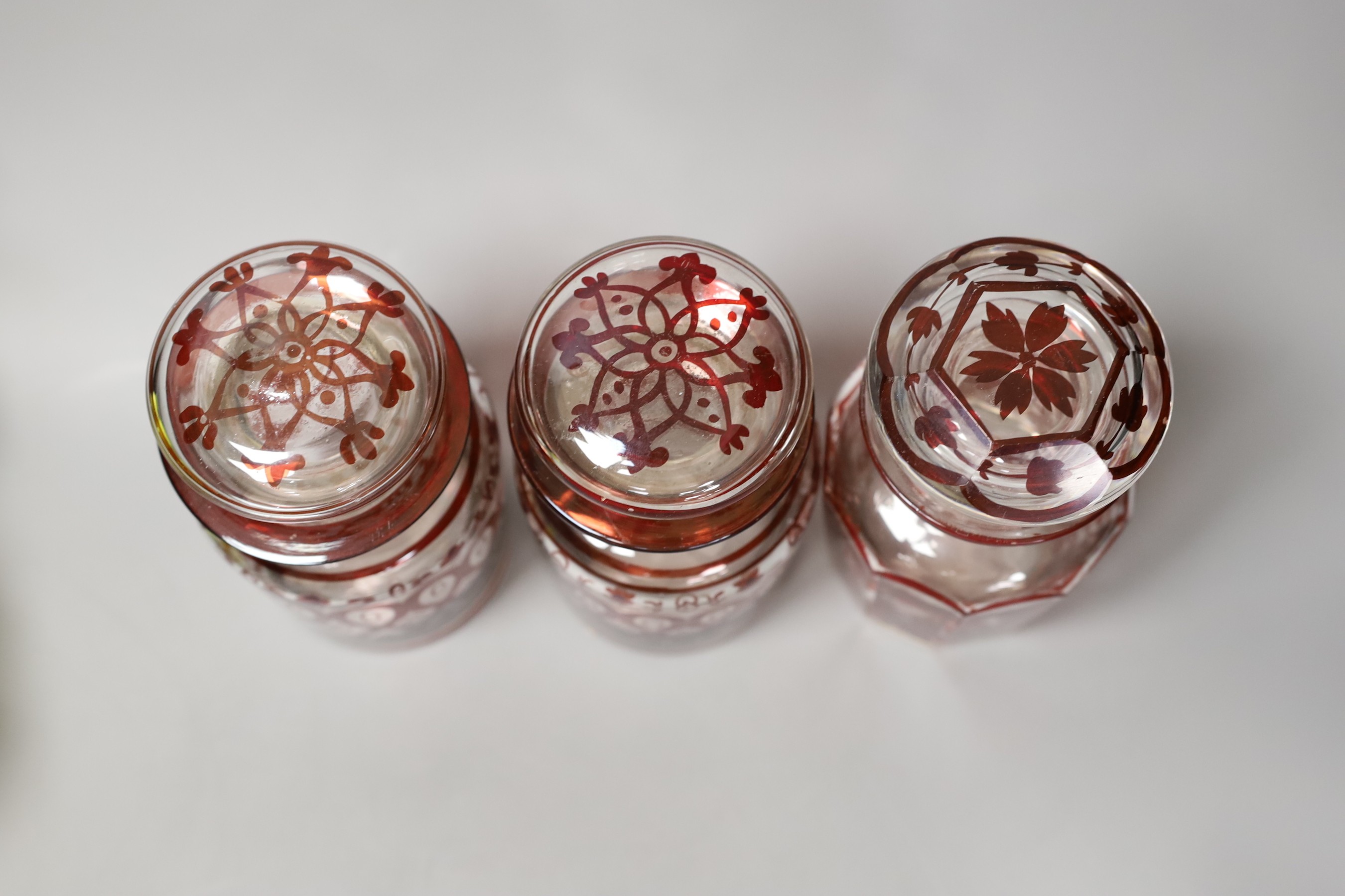 A pair of ruby overlaid goblets, three ruby and glass pickle jars and other sundry glassware